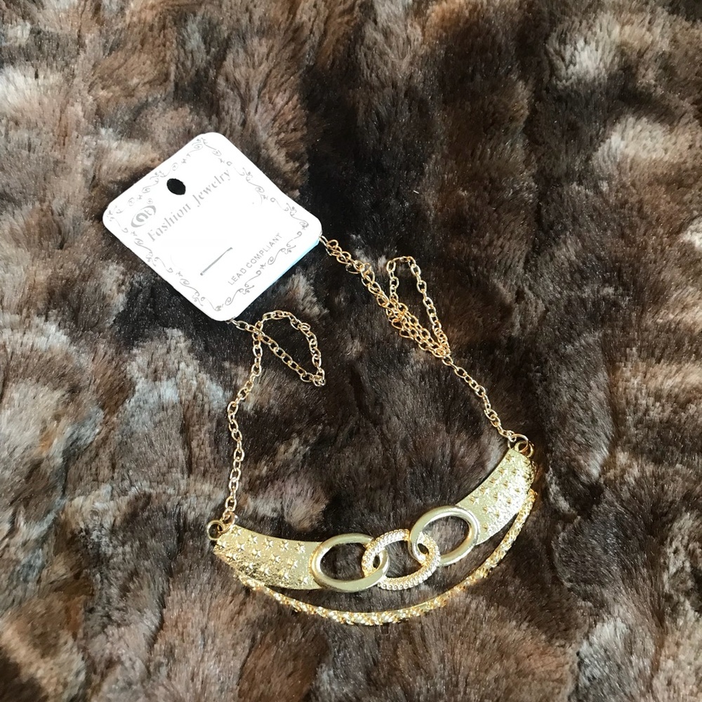 Gold tone necklace.